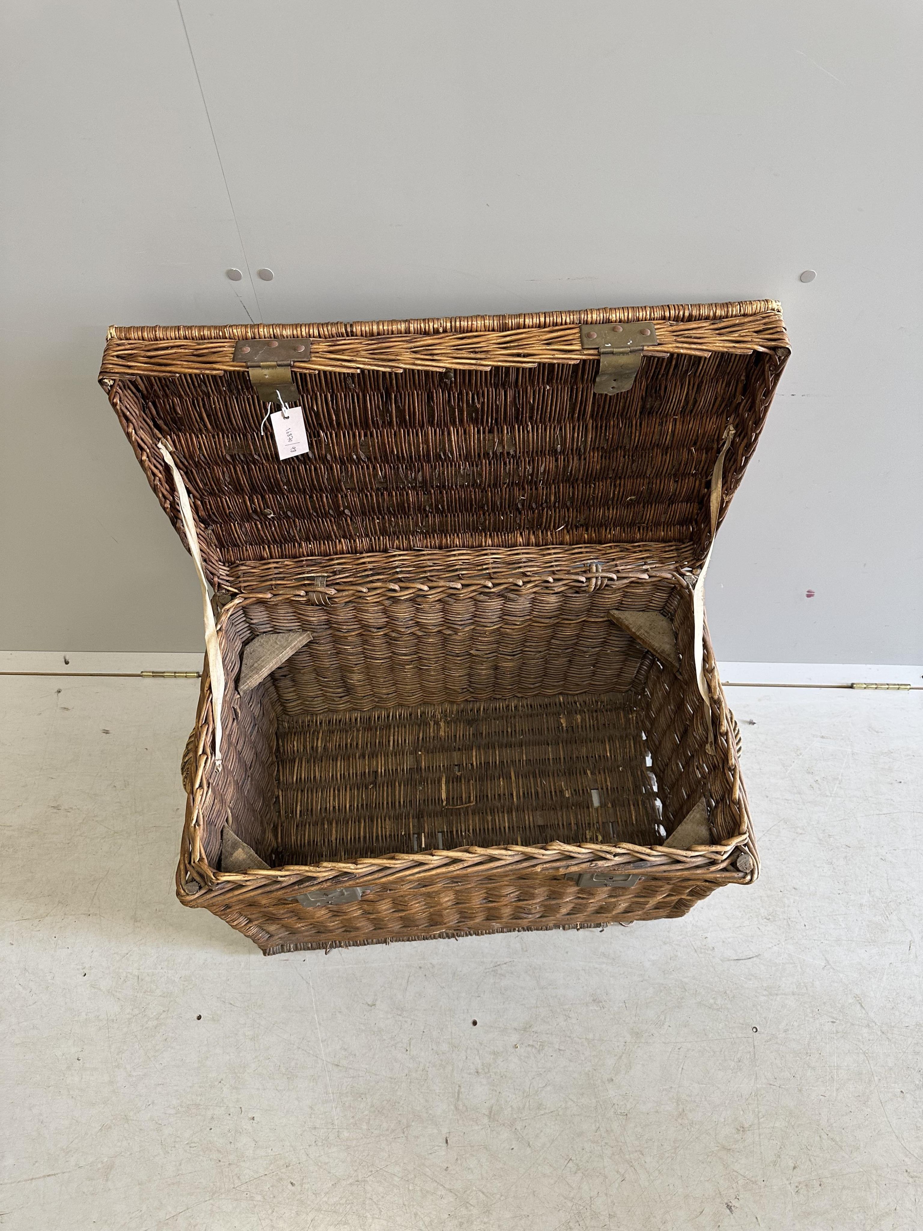 A vintage brass mounted wicker trunk, width 72cm, depth 44cm, height 50cm. Condition - fair